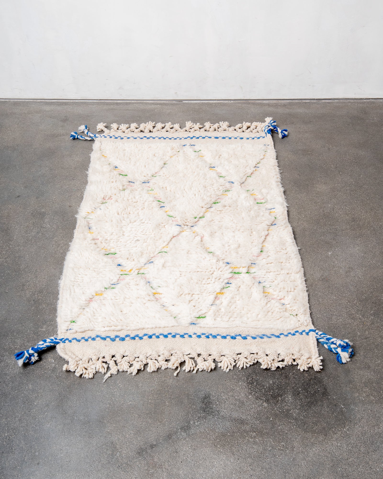 Modern, designer, handcrafted Berber rug from Morocco. Beniourain carpet with beautiful colours and patterns and fluffy wool texture.